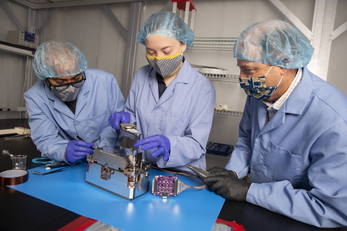 Aerospace Engineering Professor Glenn Lightsey and graduate students Brandon Colón and Lacey Littleton assemble the propulsion system developed at Georgia Tech for the Lunar Flashlight CubeSat. (Credit: Candler Hobbs) Aerospace Engineering Professor Glenn Lightsey and graduate students Brandon Colón and Lacey Littleton assemble the propulsion system developed at Georgia Tech for the Lunar Flashlight CubeSat. (Credit: Candler Hobbs)