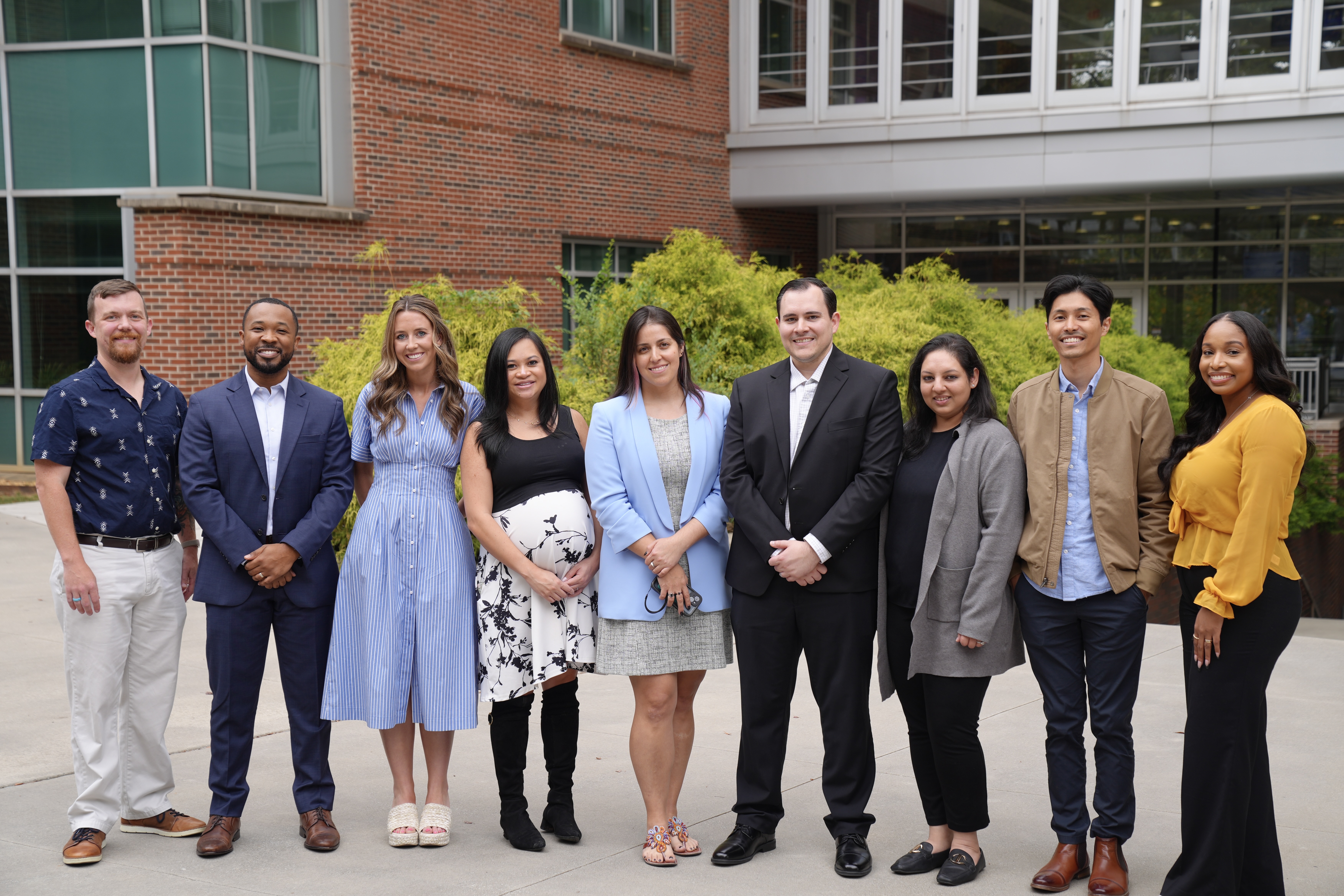 Group photo of nine Georgia Tech alumni standing in a row outside of a building Group photo of nine Georgia Tech alumni standing in a row outside of a building
