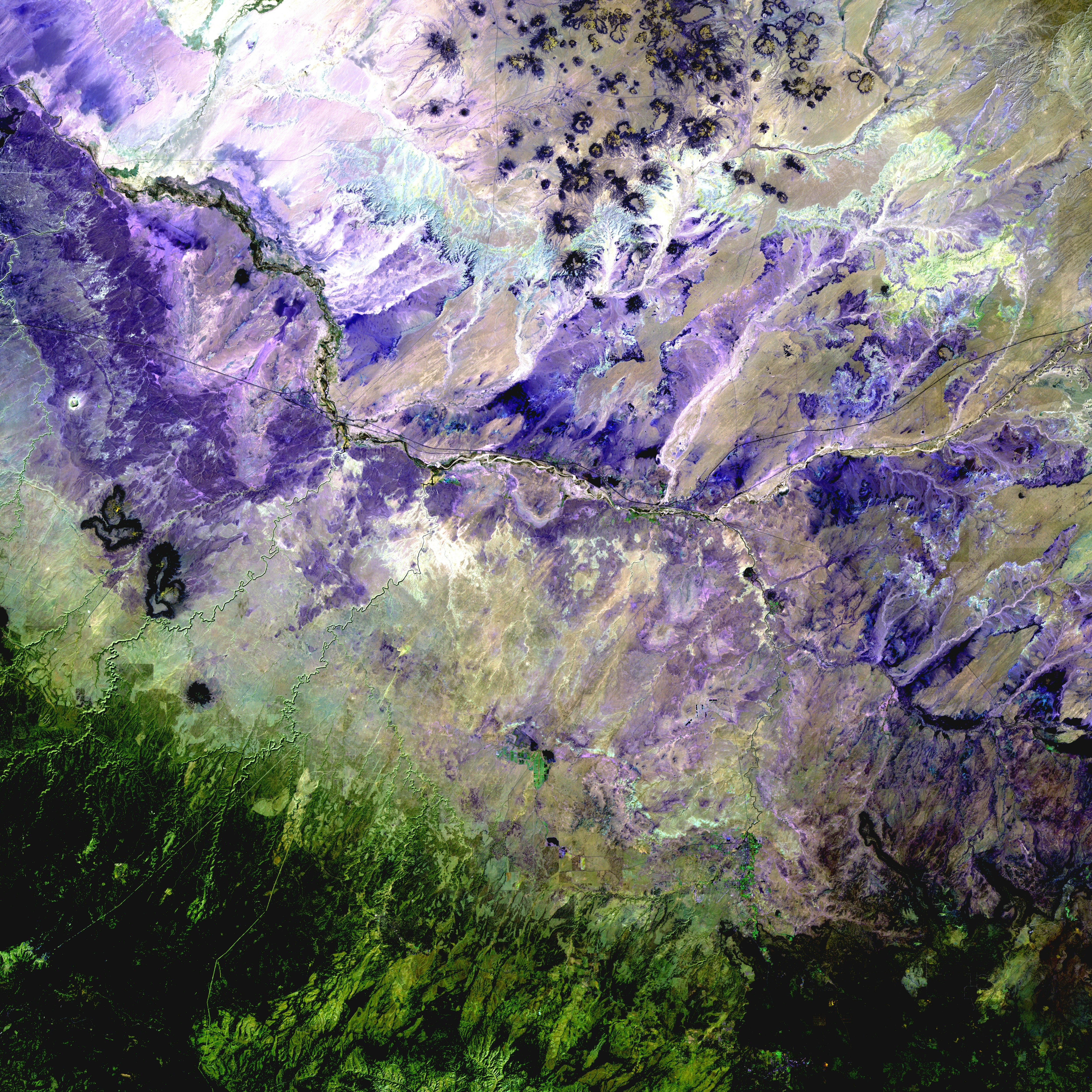 In the Painted Desert of Northern Arizona (shown here in a palette of purples), wet-dry cycling has contributed to the formation of the colorful layers visible in the landscape. (Credit: USGS) In the Painted Desert of Northern Arizona (shown here in a palette of purples), wet-dry cycling has contributed to the formation of the colorful layers visible in the landscape. (Credit: USGS)